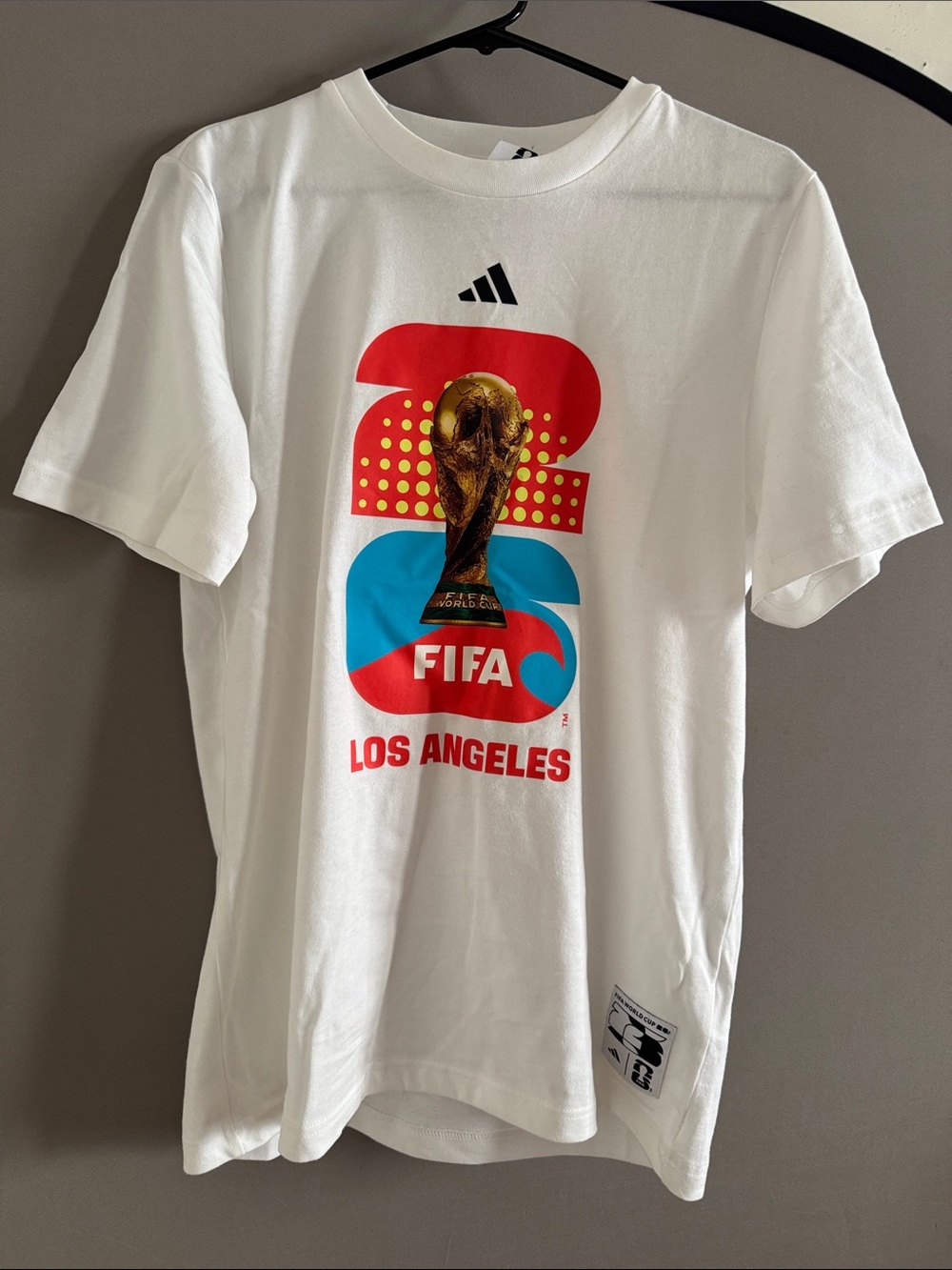 adidas White Tee with Red, Blue & Gold FIFA Los Angeles Graphic